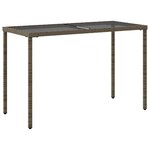 vidaXL Table de jardin dessus en verre gris 115x54x74cm résine tressée